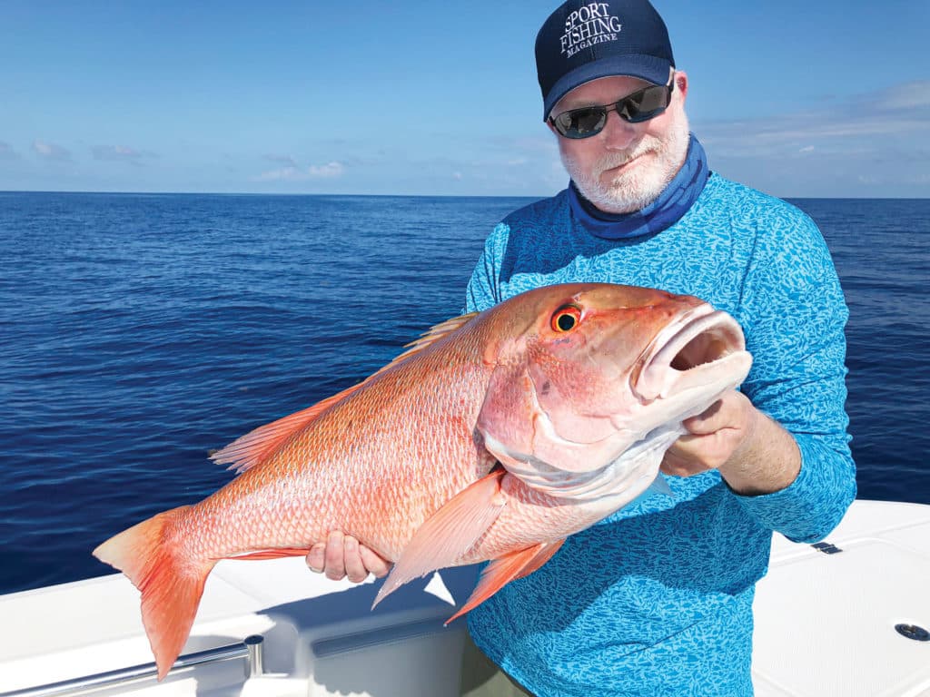 Angler holding up snapper